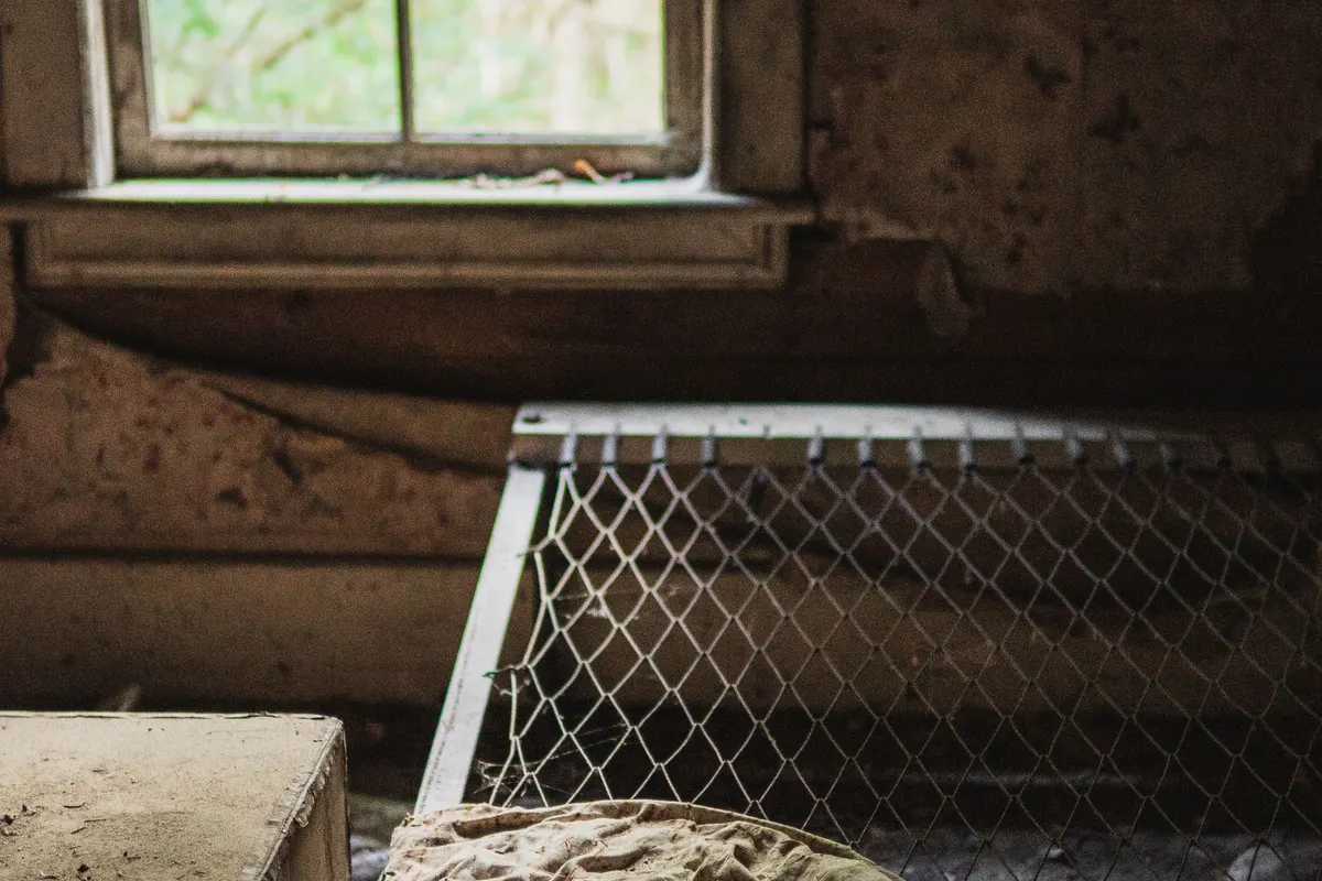 Broken furniture left inside an abandoned home